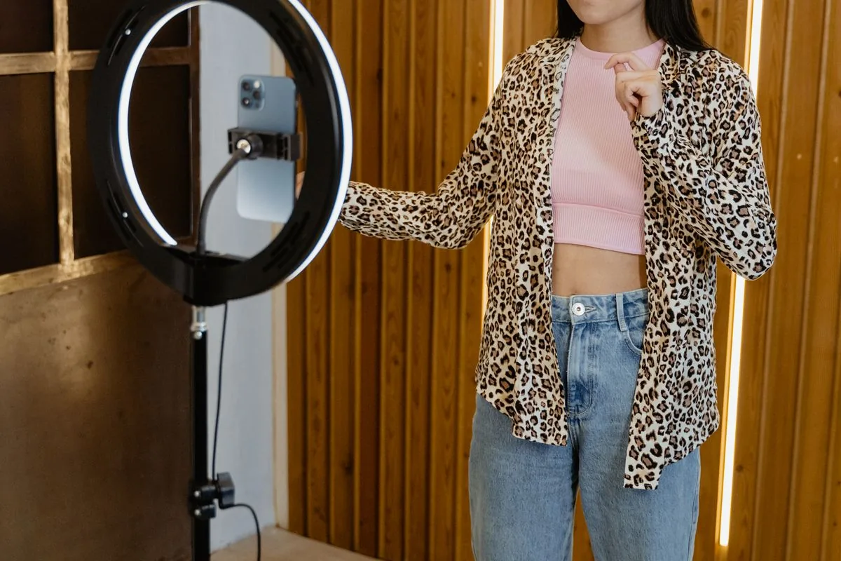 TikTok creator filming a short video with a ring light, building a real follower base after buying TikTok followers from BoostPals