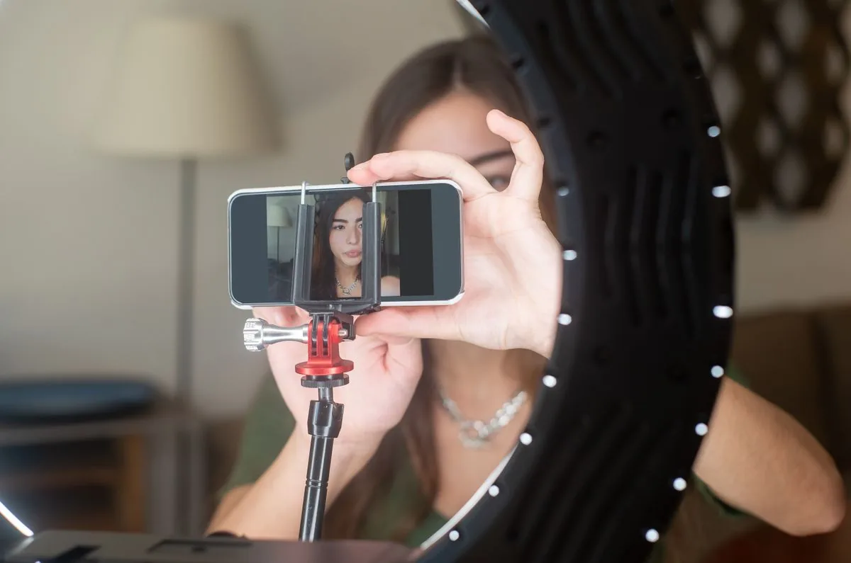 YouTube creator filming a video, building a real subscriber base after buying YouTube subscribers from BoostPals