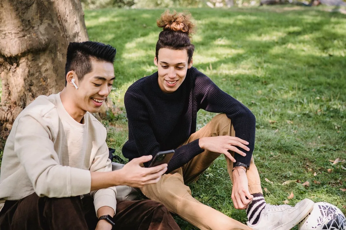 Two viewers watching and enjoying a YouTube video together, the real engagement a healthy like count signals to new viewers