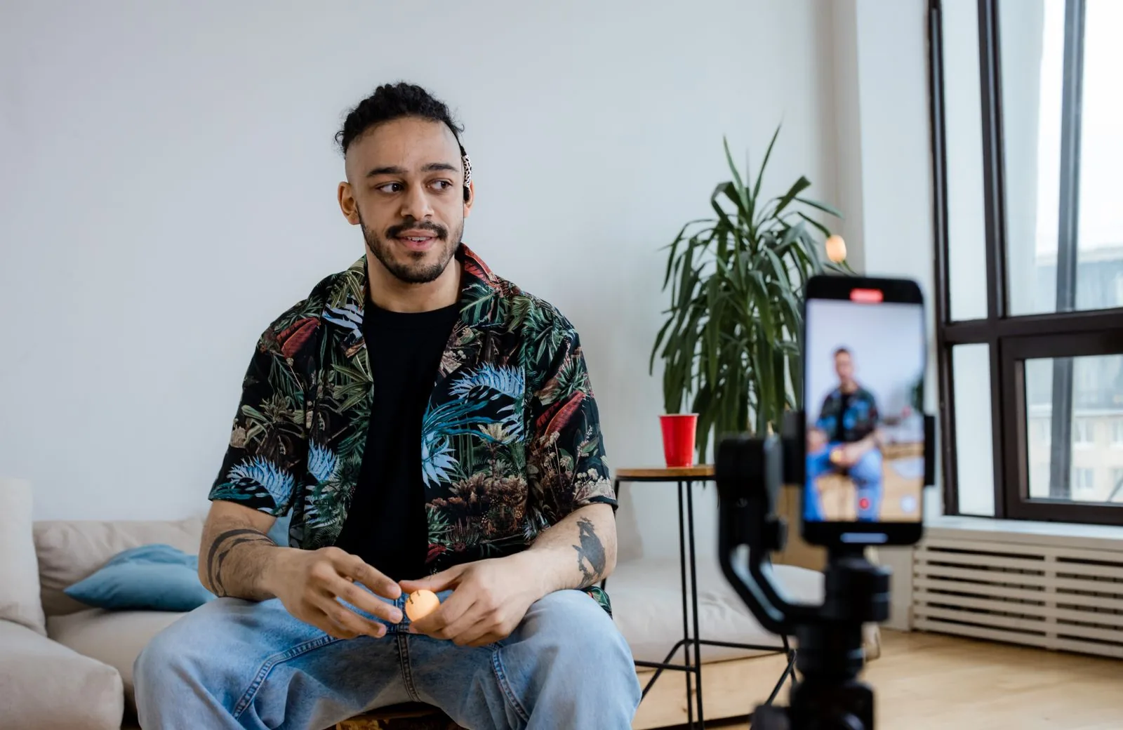 Content creator filming a YouTube video, the kind of real content that earns valid high-retention views