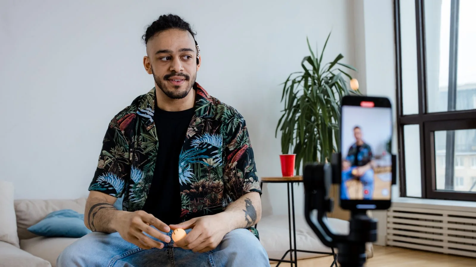 YouTube creator checking a video's view-count analytics after buying real YouTube views from BoostPals