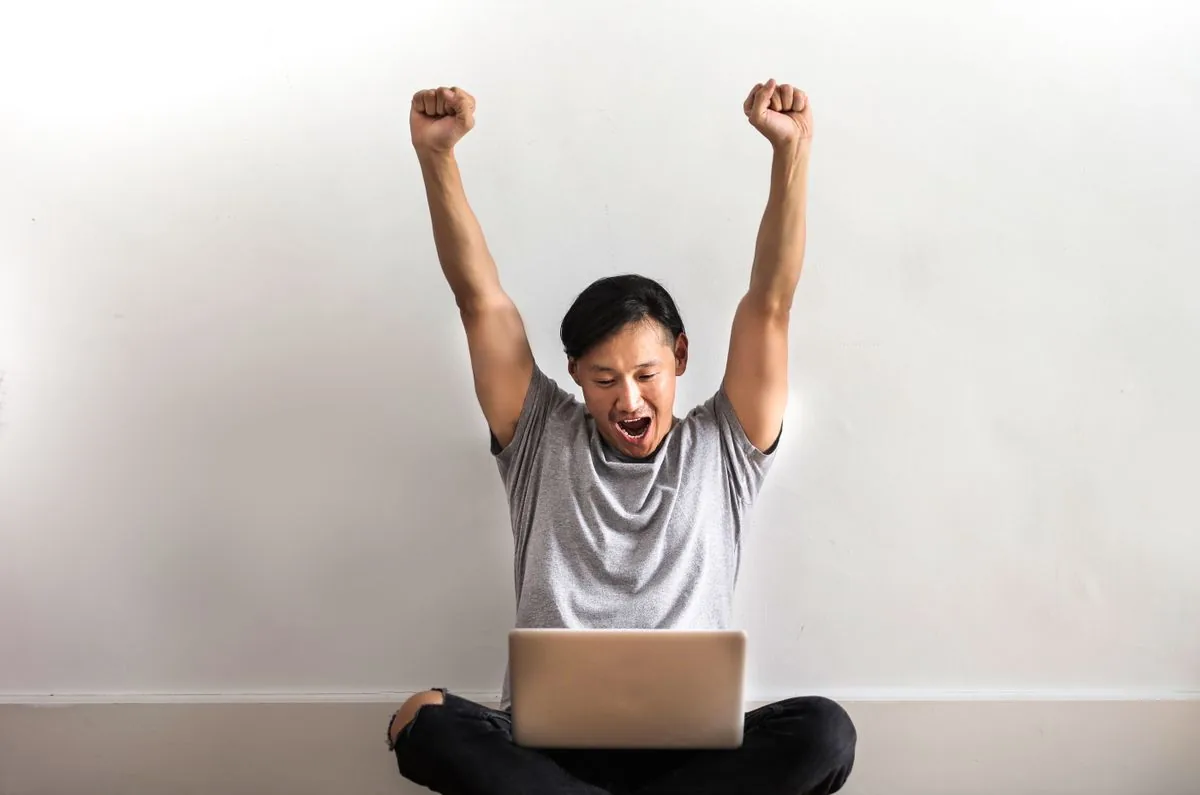 Creator celebrating YouTube Partner Program approval after reaching 4,000 watch hours and passing the monetization review